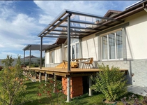 Навес из монолитного поликарбоната односкатный пристрой к дому над входной группой